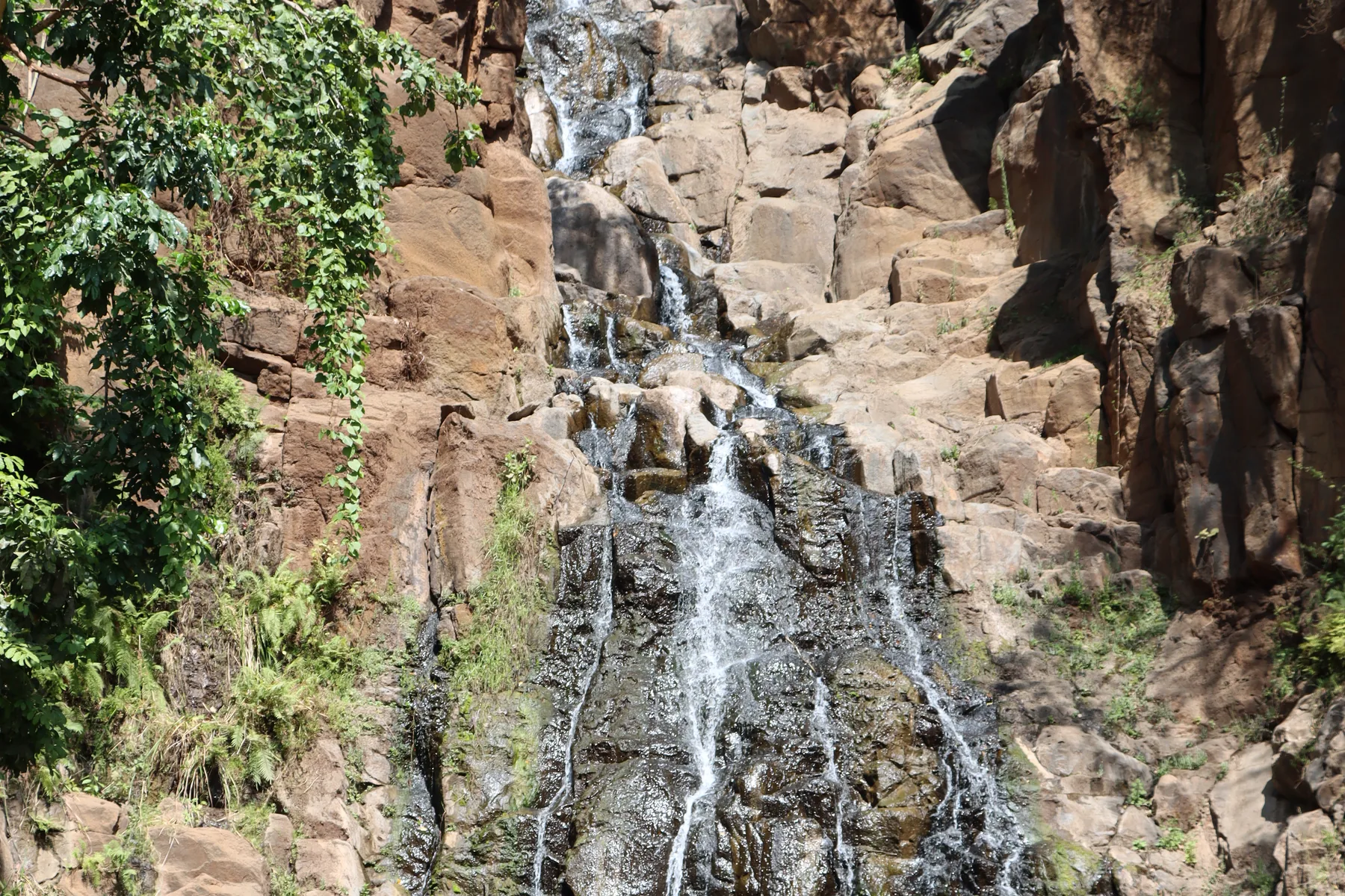 Rocky waterfall reached on a walk near Arusha