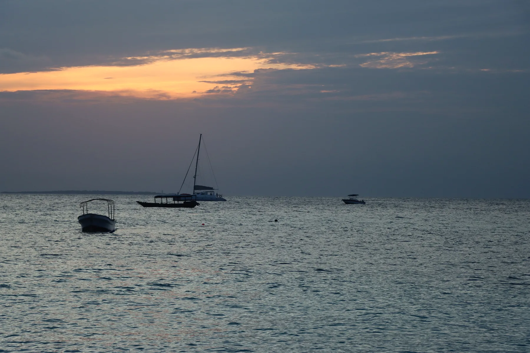 Sailing boats at sunset off Zanzibar